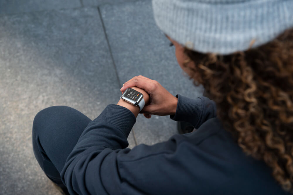 lady checking apple watch that she is wearing